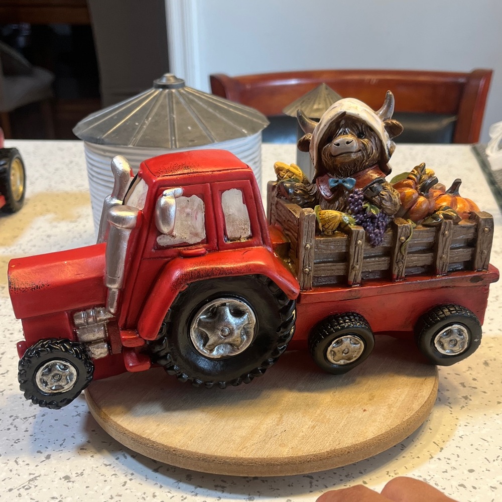 Fall highland cow with Red Tractor (resin)